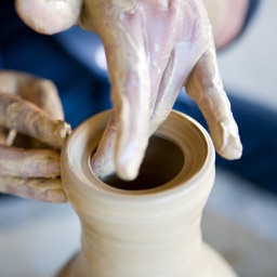 Making a clay pottery storage jar with lid on a potters wheel demo